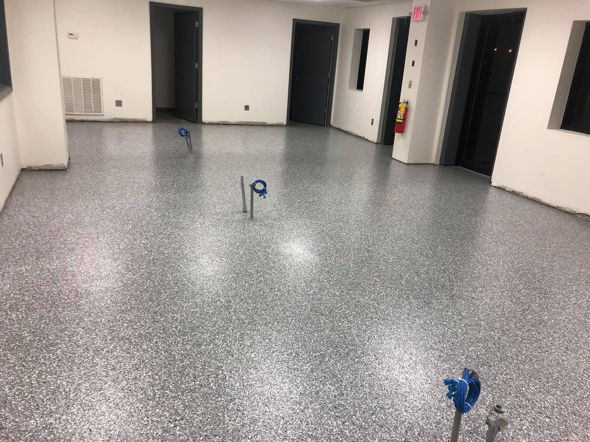 Epoxy and flake with a polyurea topcoat for a commercial showroom.